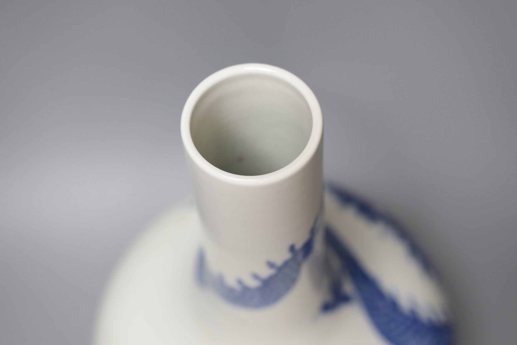 A Chinese blue and white dragon bottle vase, 37cm tall